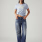 Women's Med Indigo Loose Bootcut Fit Mid Rise Jeans - Styleshot View