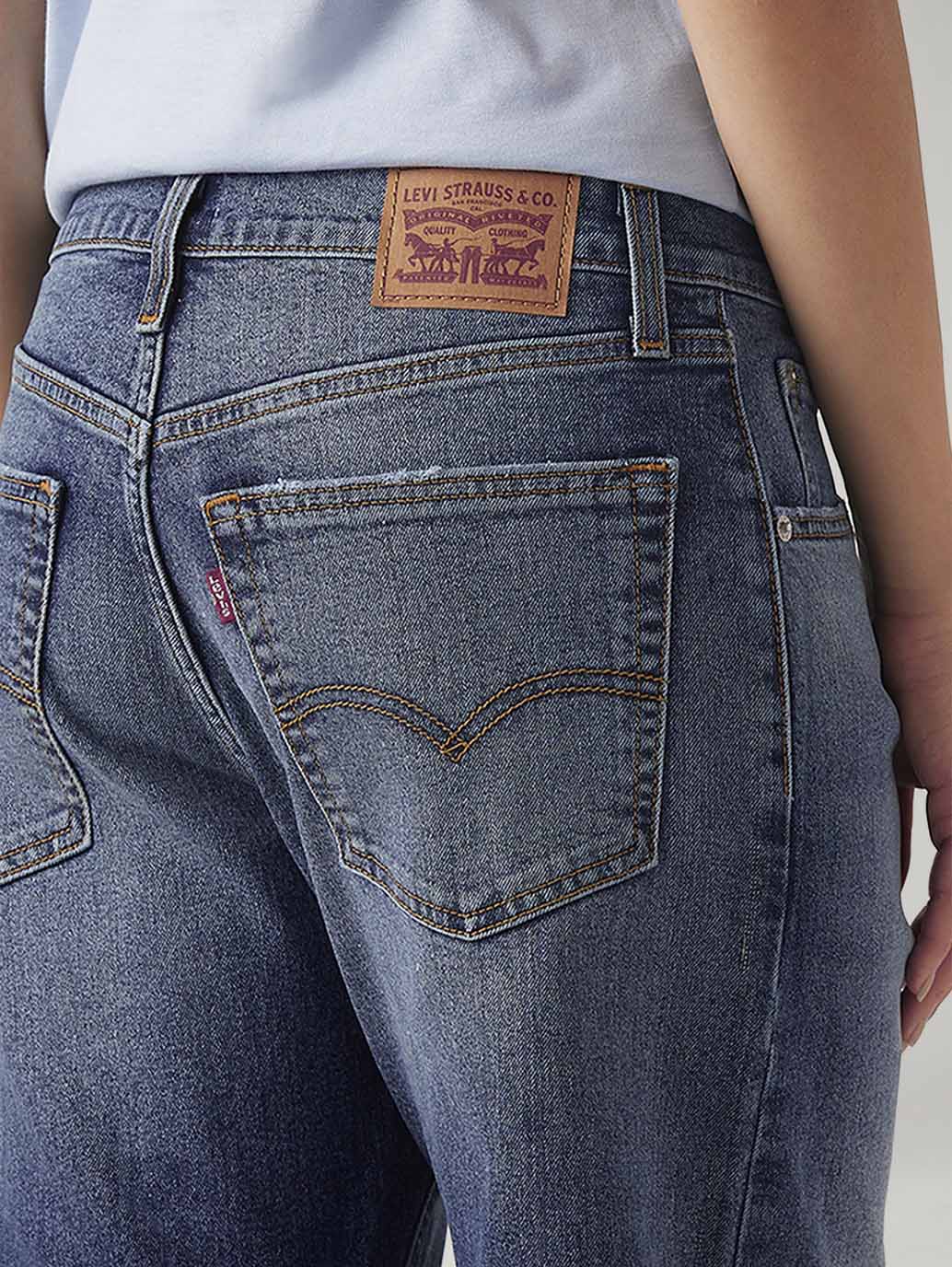 Women's Med Indigo Loose Bootcut Fit Mid Rise Jeans - Detail View