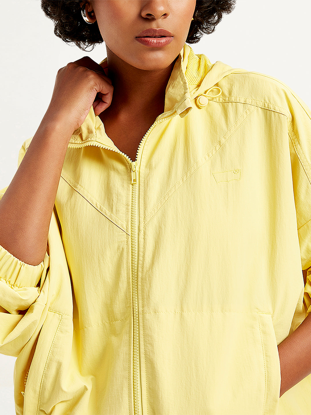 Women's Solid Yellow Hooded Windcheater Jacket - Detail View